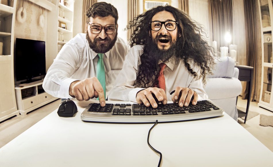 Two men having fun on computer