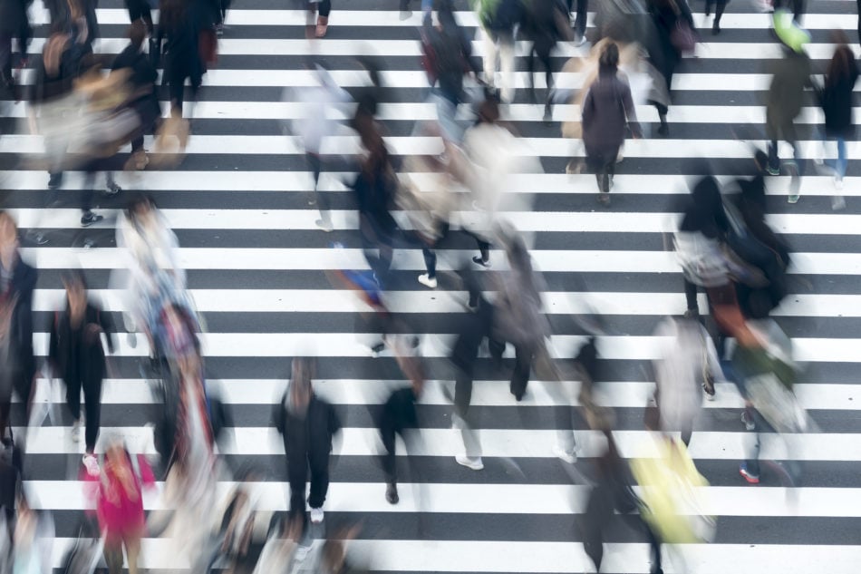 Crowd of people crossing a street